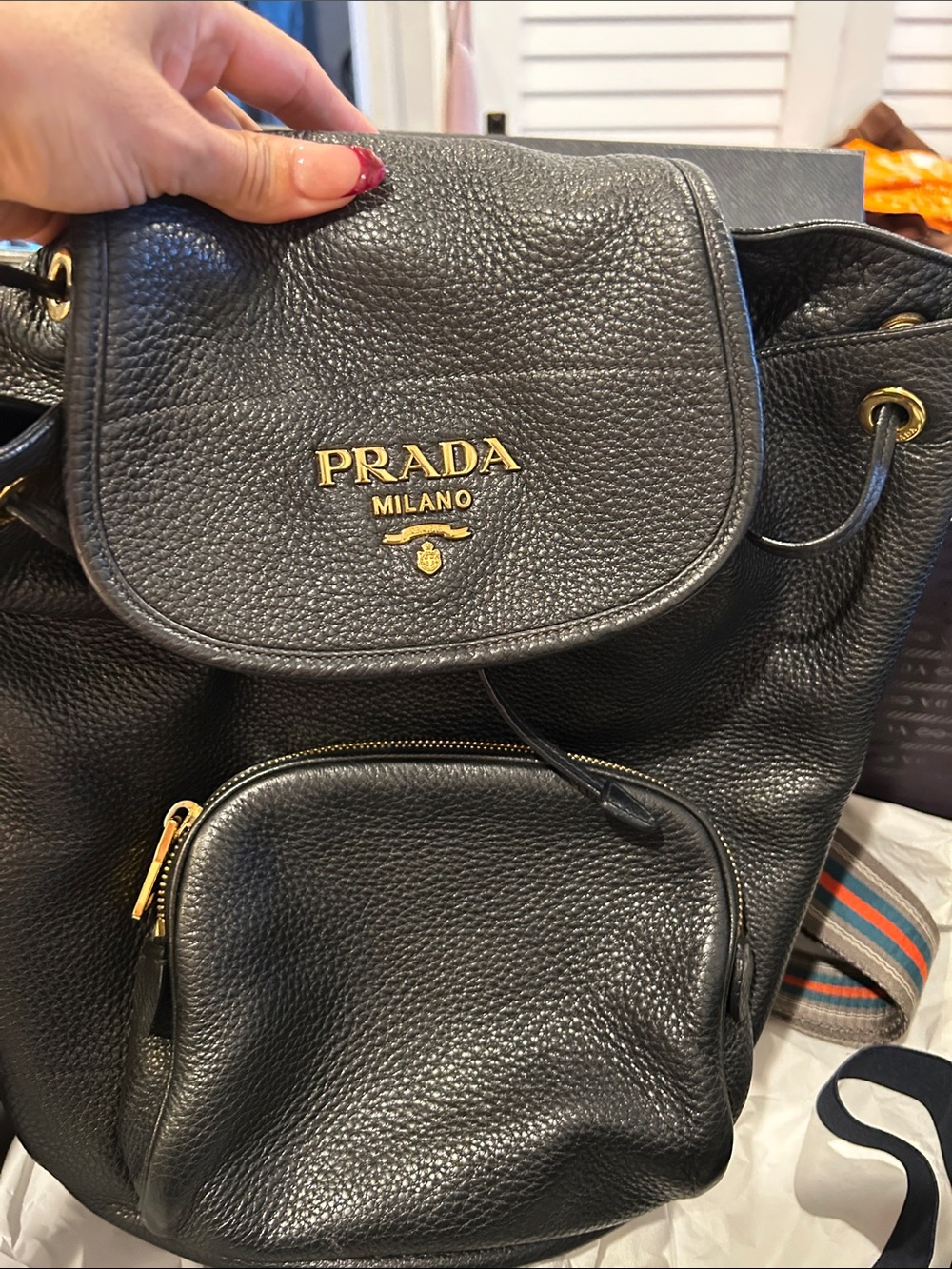 Prada Black Pebbled Leather Drawstring Backpack with Gold Logo